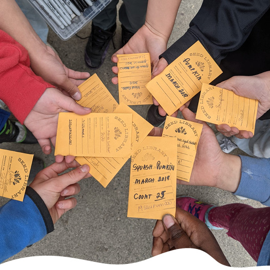 awaken garden collective members standing in garden