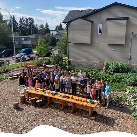 awaken garden collective members standing in garden