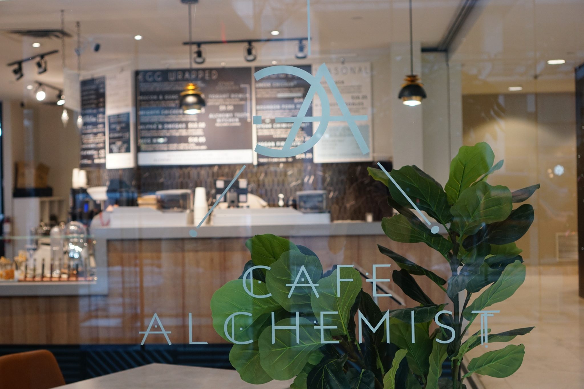 Looking through the window of Cafe Alchemist towards their counter.
