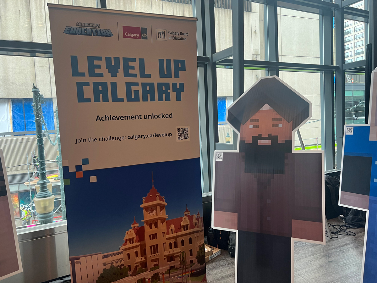 Level Up Calgary poster and Minecraft cardboard cutout.