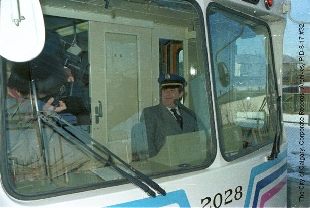 Mayor Ralph Klein in the operators cab of a CTrain. 