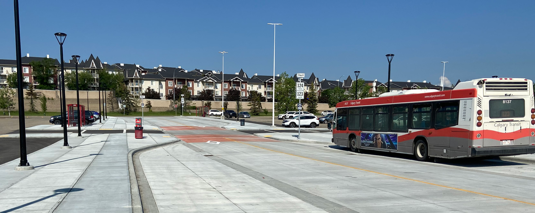 Bus park at North Pointe Park and Ride lot, with cars in parking spots in the background.