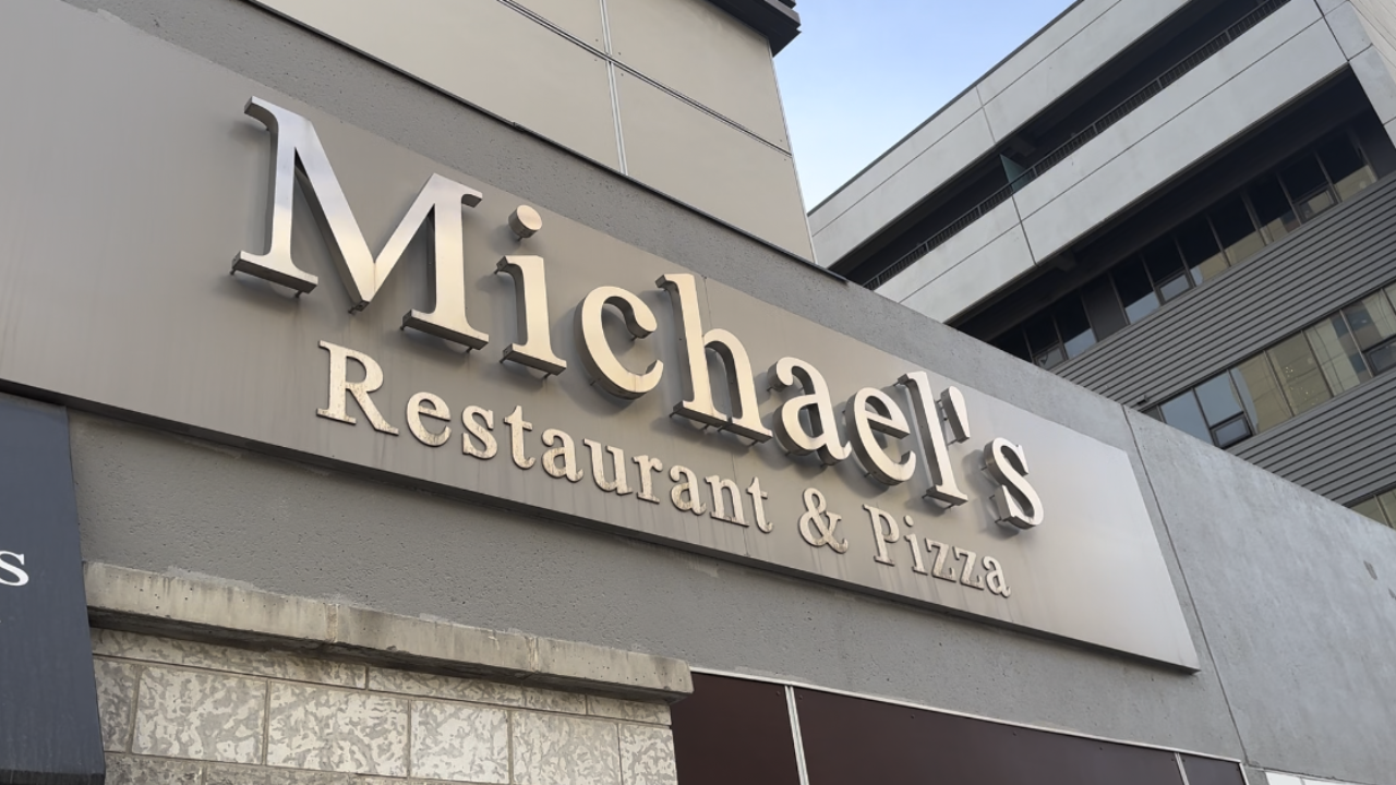 View of Michael's Restaurant & Pizza outside sign.