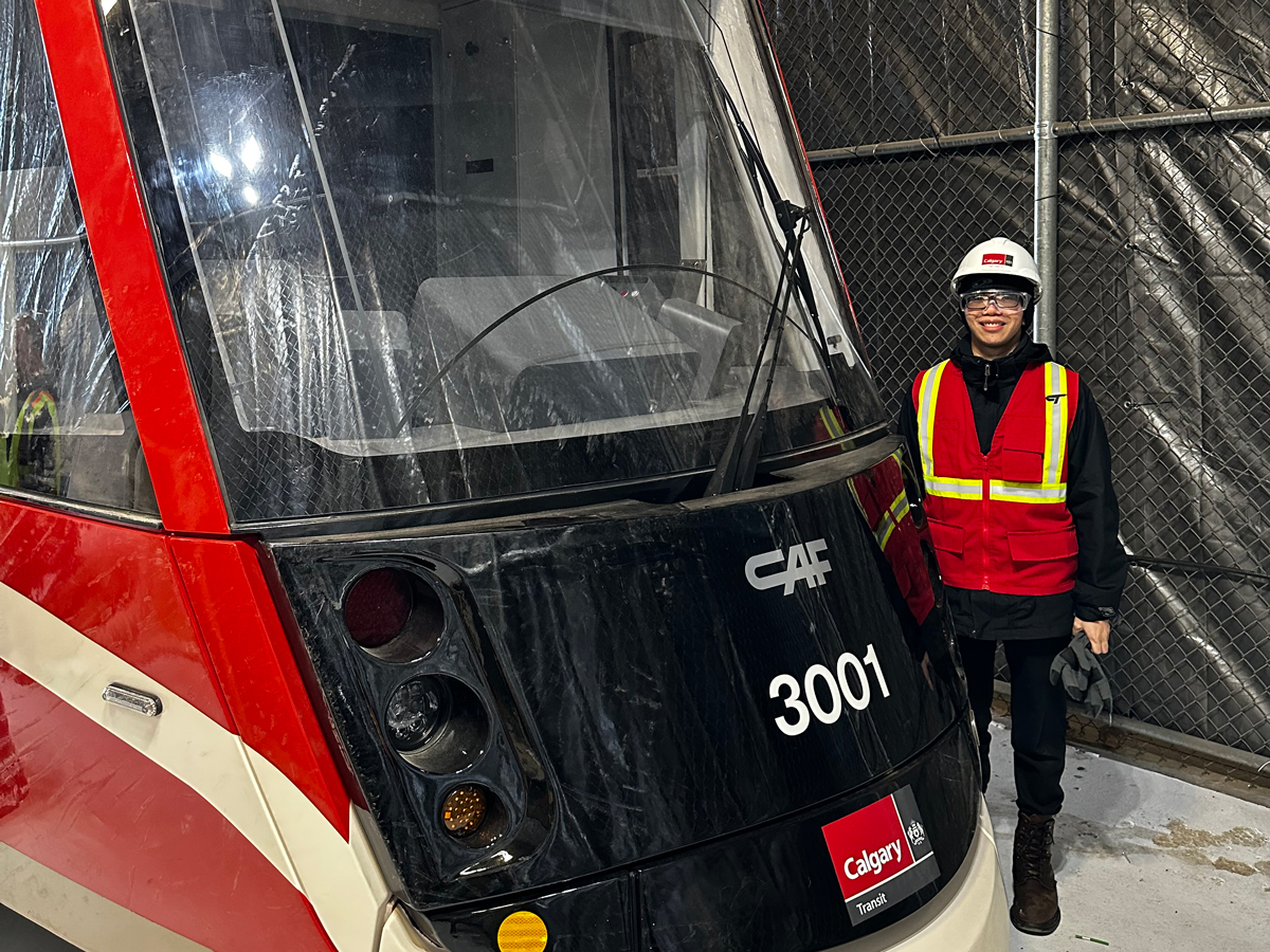 Nathan Yu standing to the right of the LRV mock-up.
