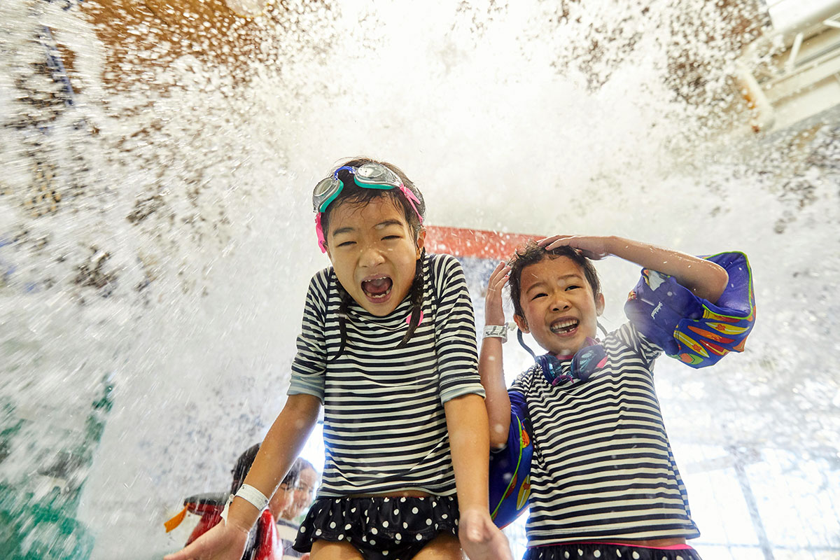 Kids getting splashed with water
