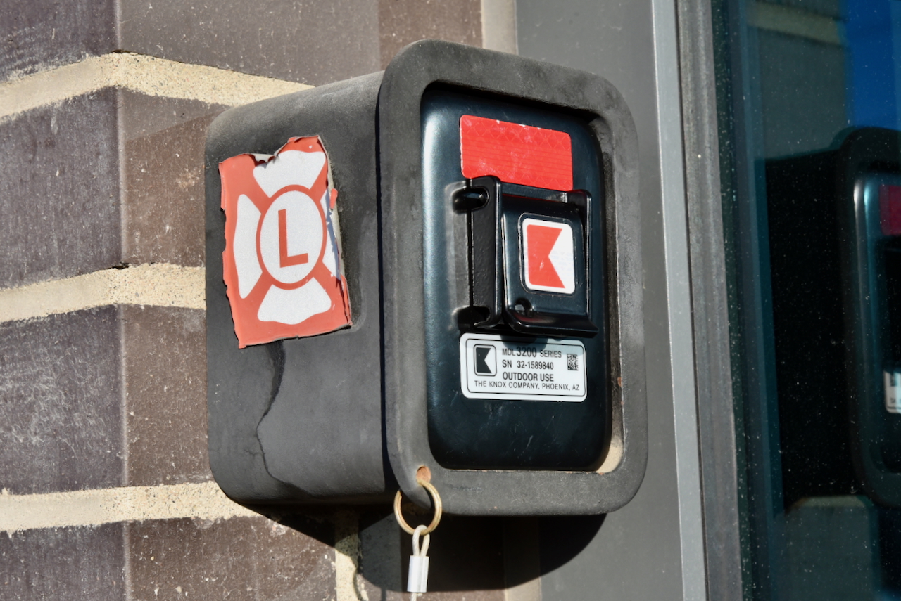 Firefighter opening a lockbox