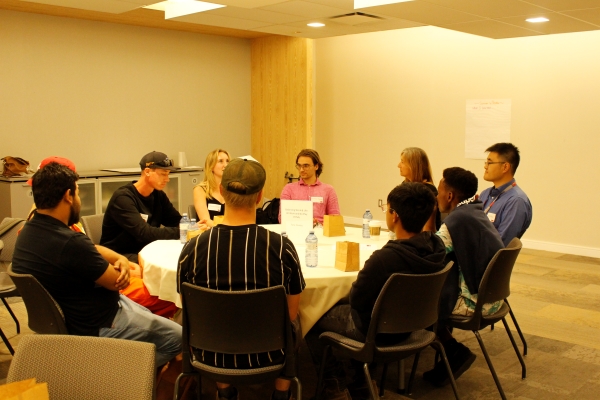 People sitting around a table during a focus group session